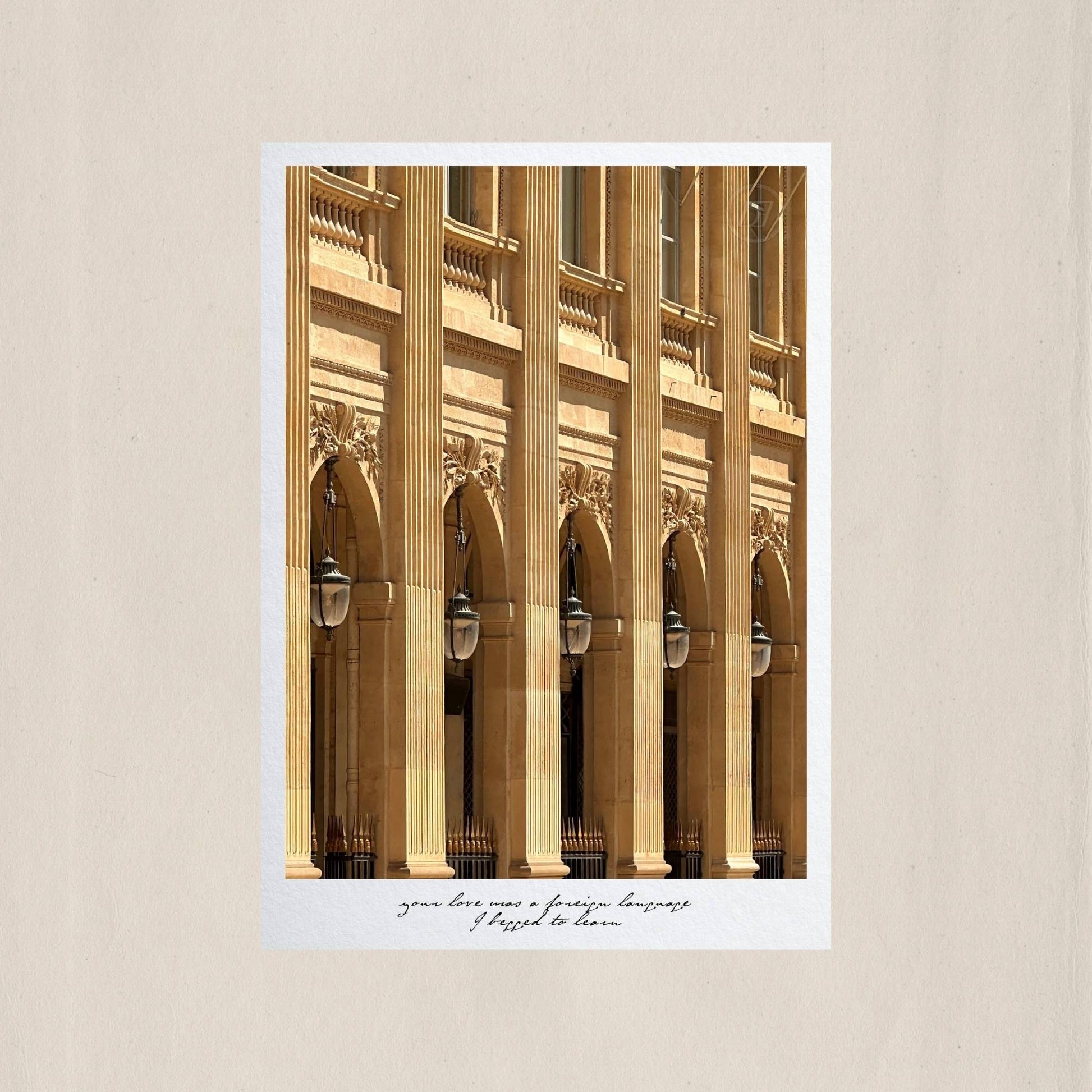 The rhythmic arches and fluted columns of Palais Royal bathed in warm Parisian light – Des Épigraphes. Captured by Tolga Avan.