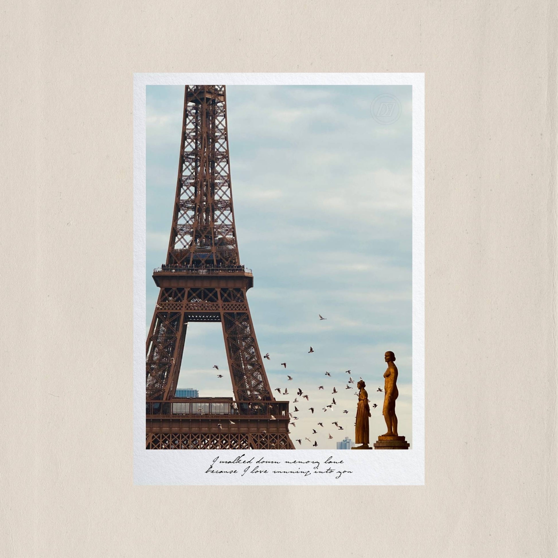 The iron silhouette of the Eiffel Tower rising above the golden statues of Trocadéro, as birds scatter across a Parisian sky – Des Épigraphes. Captured by Tolga Avan.