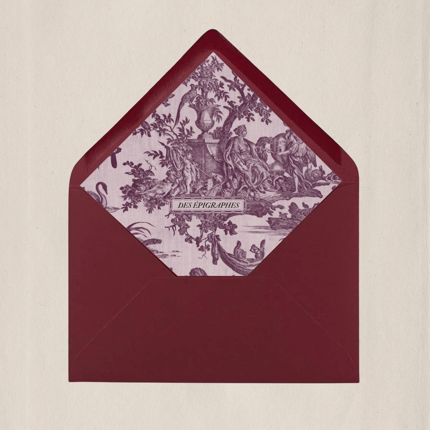 Crimson red Des Épigraphes envelope lined with historic Toile de Jouy fabric, a tribute to timeless craftsmanship.