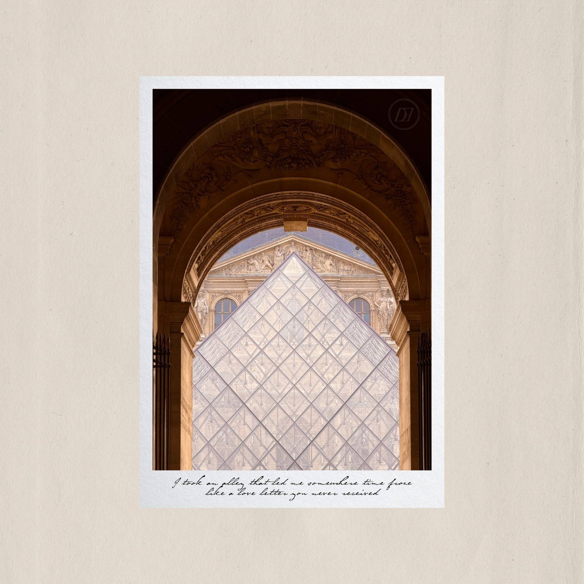 The glass pyramid of the Louvre framed perfectly within a stone arcade, where old Paris and new Paris meet – Des Épigraphes. Captured by Tolga Avan.